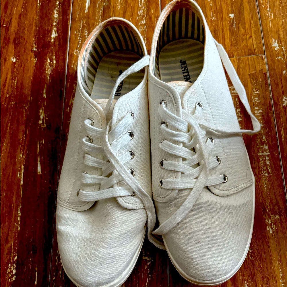 White lace up tennis shoes. Size 11.